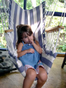 mia in swinging chair dragonfly ranch bed and breakfast